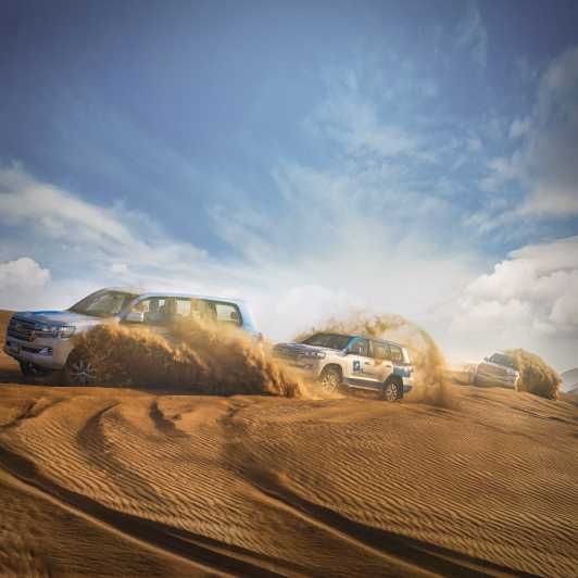 Imagen del tour: Abu Dhabi: Safari por el desierto con barbacoa, paseo en camello y Sandboarding